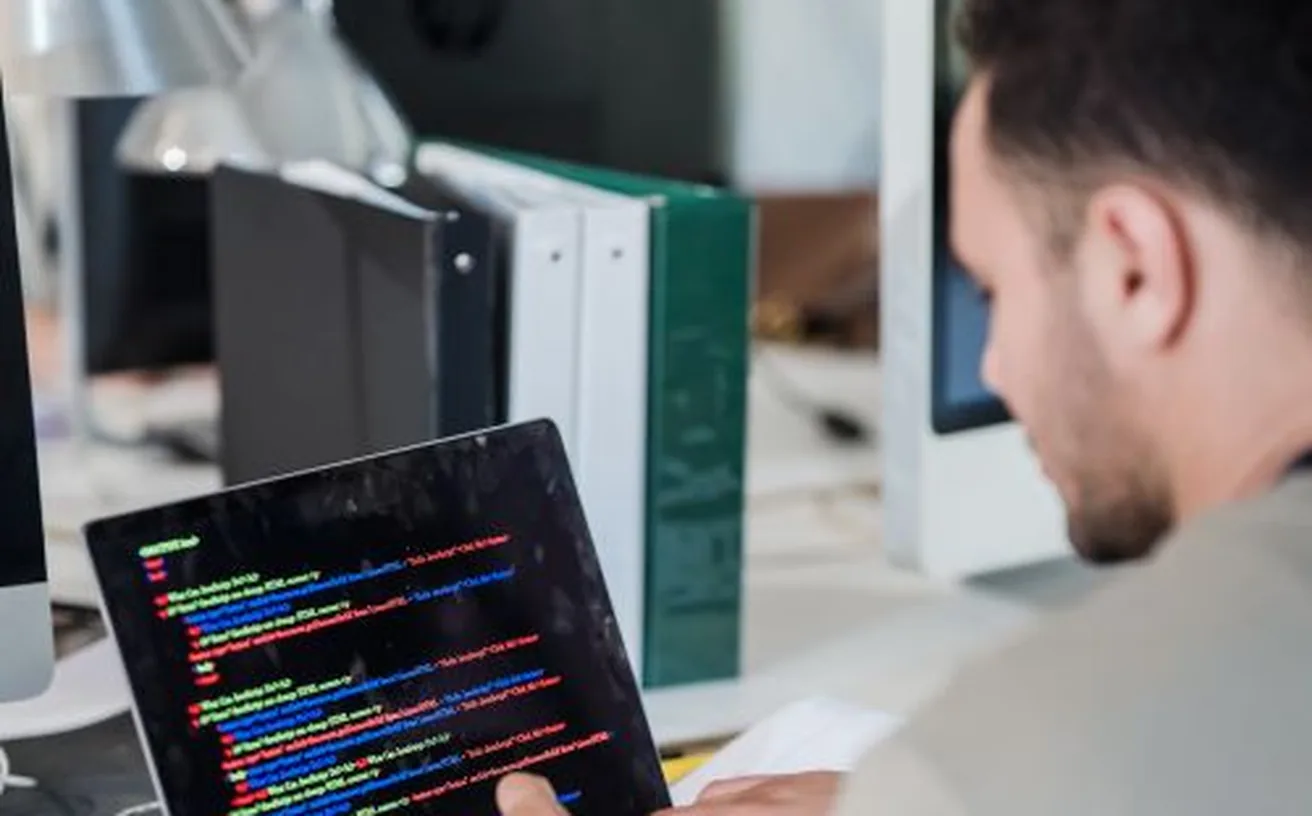 Developer building a website on a laptop